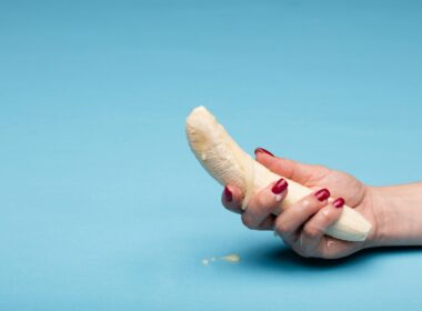 person holding white seashell during daytime